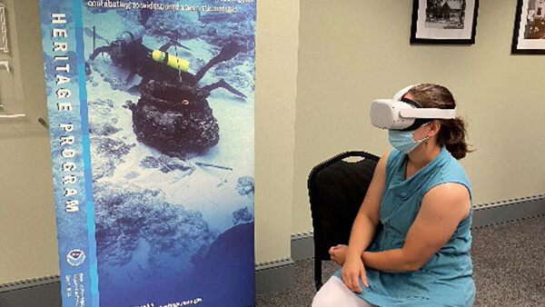 a woman looking into vr goggles