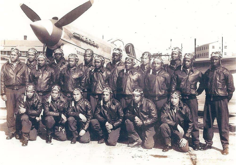 group photo infront of a plane of the Tuskegee Airmen Class 44-B