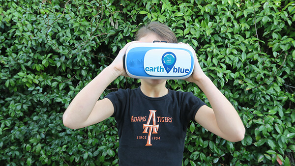 a child using a virtual reality headset to view a 360 video