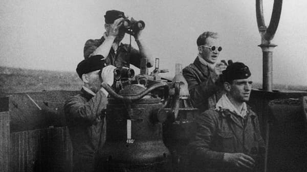 Members of a ship lookout with binoculars