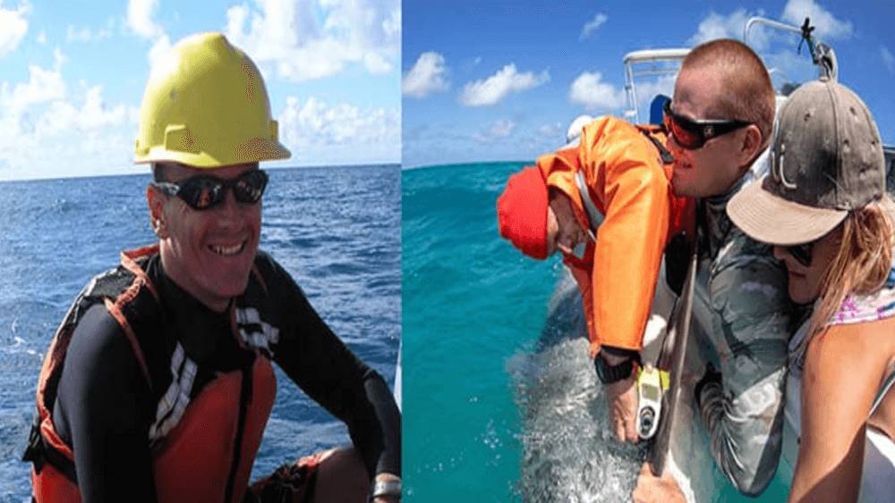 From left to right: Man smiling with an orange life jacket, a yellow hard hat, and black sunglasses. Two male researchers and a female researcher tagging a shark off the side of a boat.