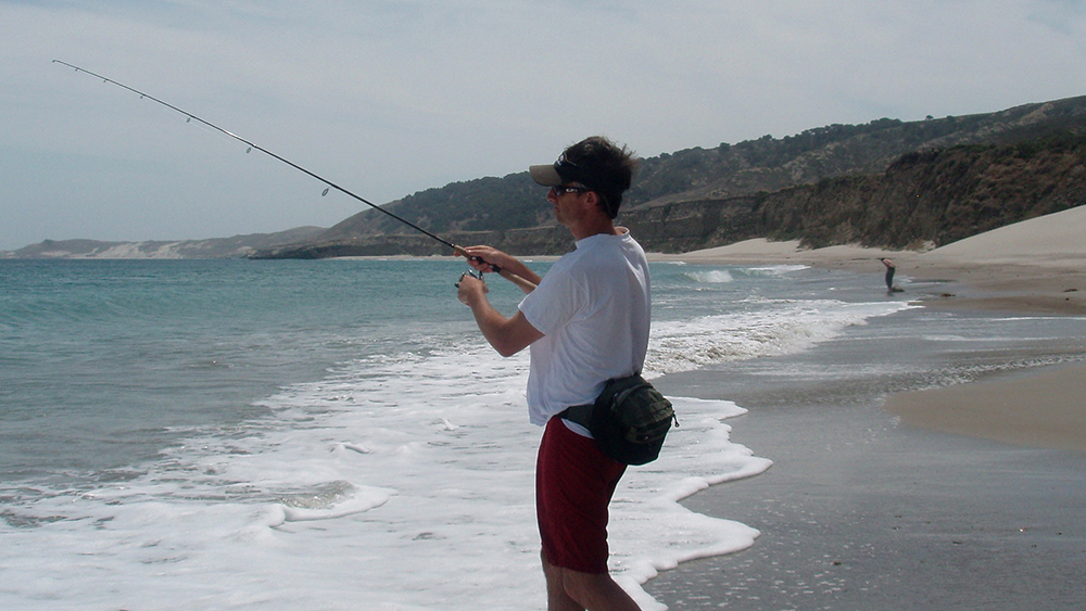 a person fishing from shore