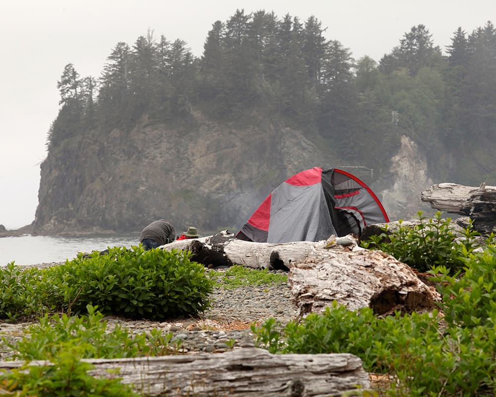 a tent on a remote beach