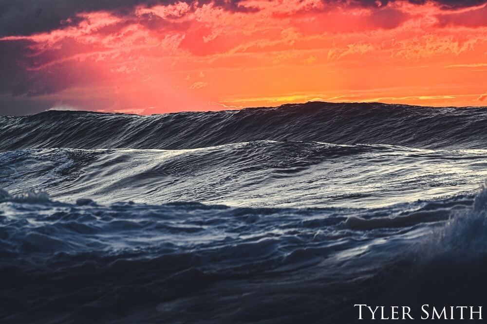 Waves rolling in while the sunsets.