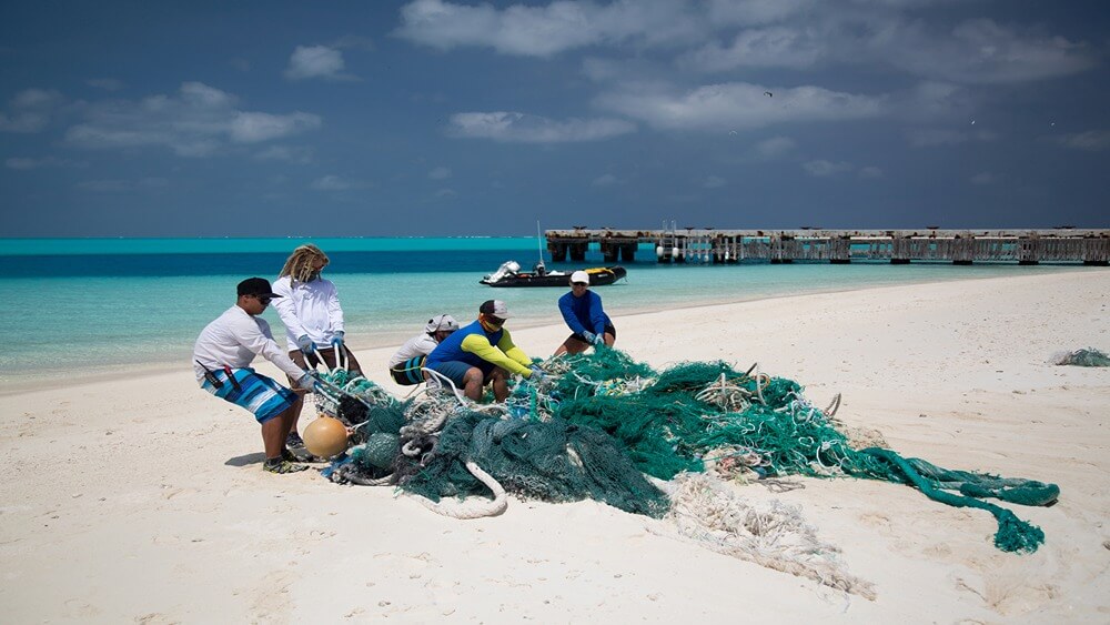 A team removes some of the marine debris that has washed up in Papahānaumokuākea Marine National Monument. These fishing nets and other kinds of plastic debris enter the monument from sources all over the ocean and demonstrate why underwater park managers have to worry about things that go on far outside the boundaries.