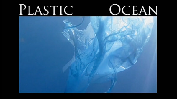 Black frame with white text “Plastic Ocean” and image of plastic bag floating in water in center.