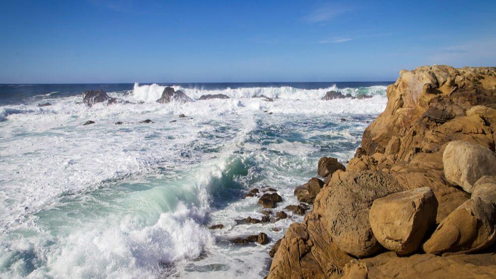 Waves crashing along a rocky shore