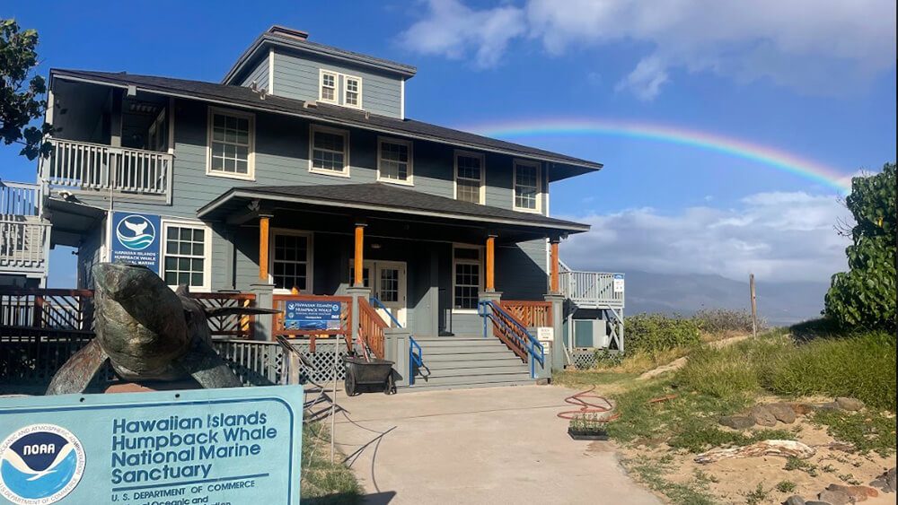 A rainbow extends behind the Kihei visitor center