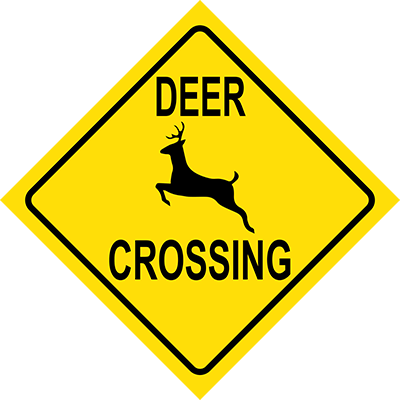 bright yellow deer crossing sign