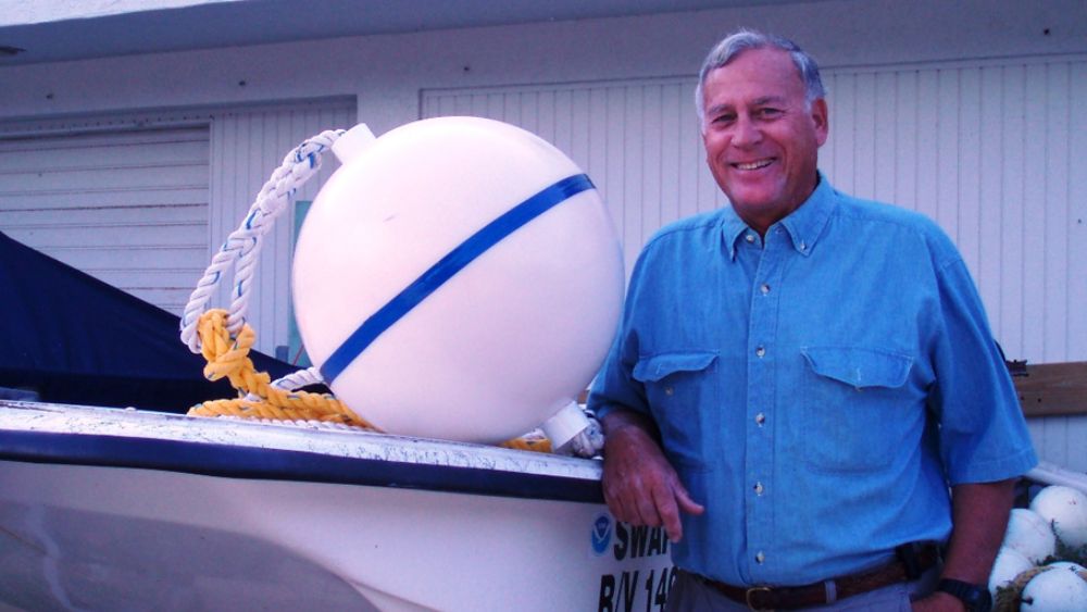 John Halas posing with a Mooring buoy
