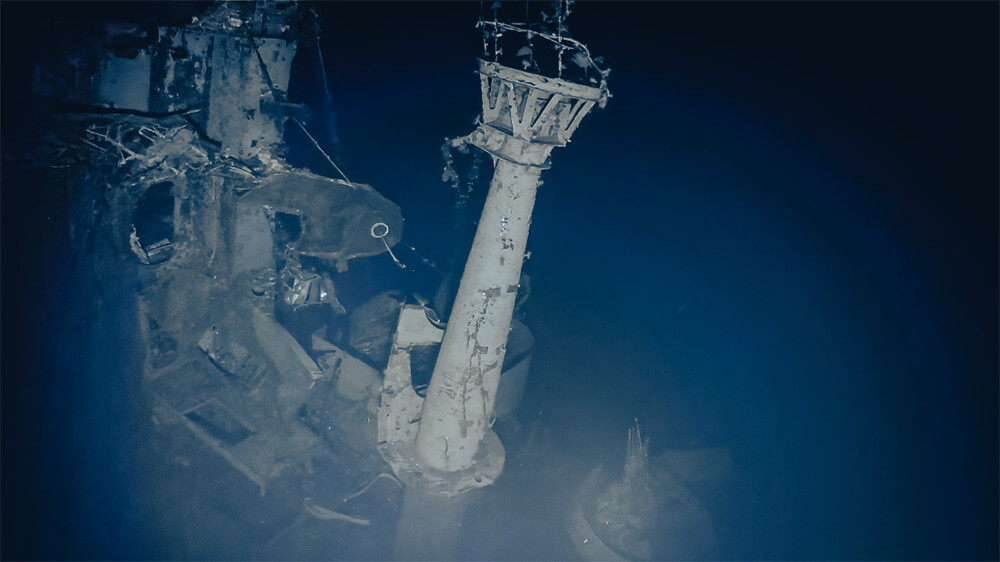 The aircraft crane of the USS Yorktown still stands at the aft end of the island. Photo captured by ROV Atalanta on September 9-10, 2023. Credit: Ocean Exploration Trust, NOAA