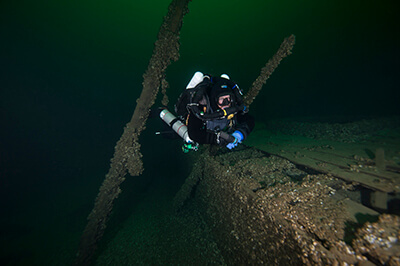 A diver swims near the wreck of The St.Peter