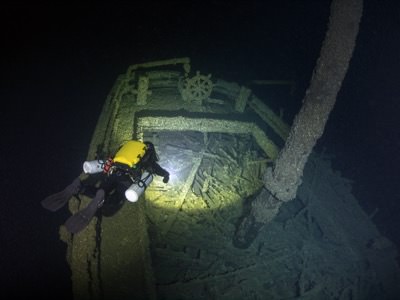 A diver inspects the stern of Queen of the Lakes