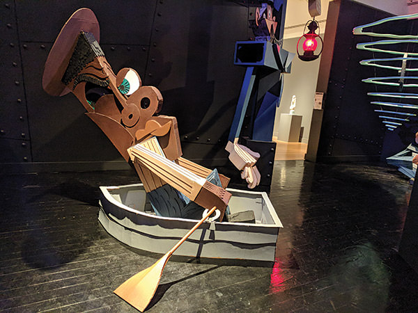 puppet of crew member in a row boat