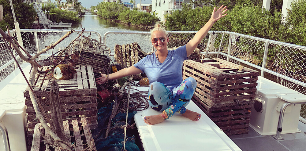 A woman posing with recovered marine debris