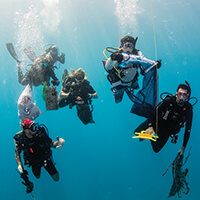 Divers cleaning up marine debris
