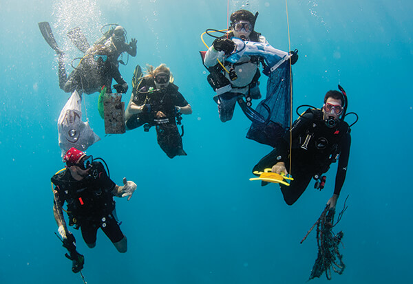 A group of divers working to clean the ocean