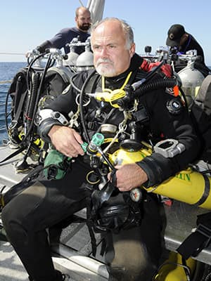 Greg McFall in diver gear on deck