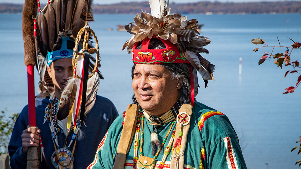 Two native Americans in traditional headresses