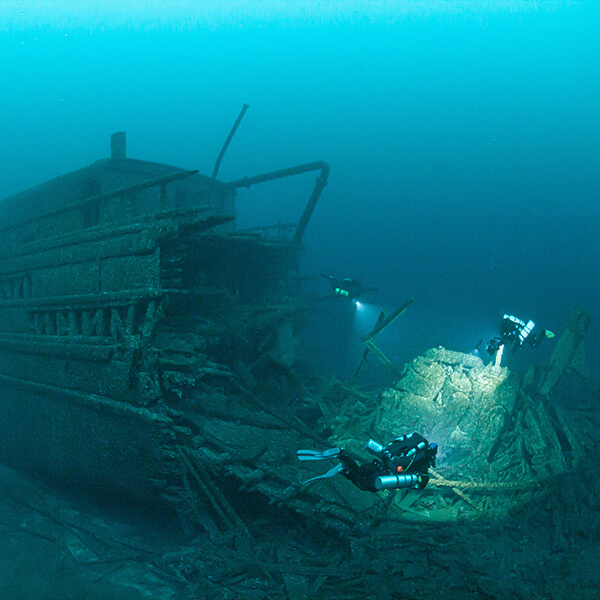 Divers explore a shipwreck