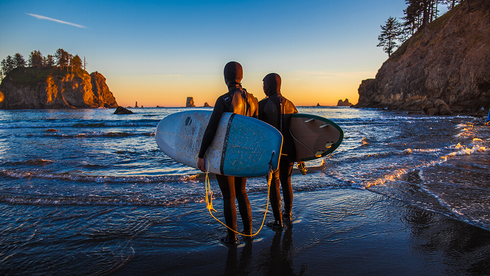 Surfers enjoy the sunset