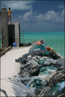 Old fishing nets get piled up on the pier on Green Island at Kure Atoll waiting for the marine debris crew to pick up.