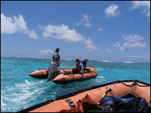 The maritime archaeology team navigates inside of the lagoon at Pearl and Hermes Atoll