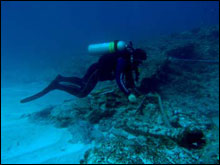 Maritime archaeologist Tane Casserley documents the whaling ship Pearl at Pearl and Hermes Atoll.
