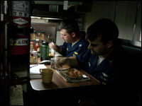 crew members eating dinner 