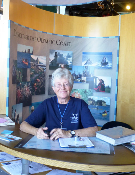 Volunteer working the front desk of the Olympic Coast Discovery Center