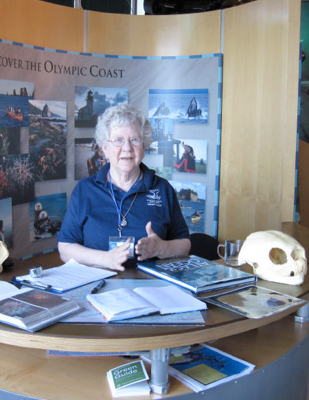 Volunteer working the front desk of the Olympic Coast Discovery Center