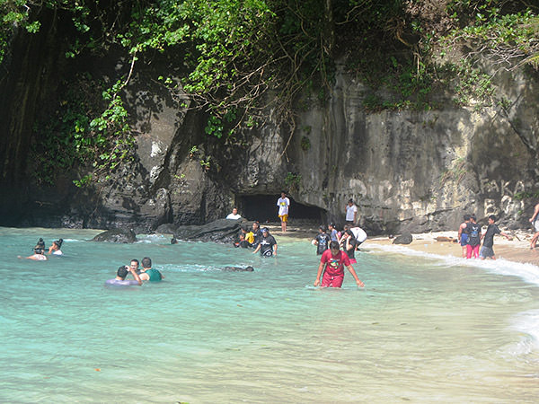students in the water near shore