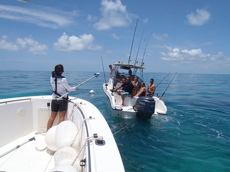 staff providing on the water education on boats