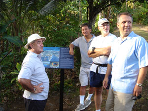 American Samoa Governor Togiola Tulafono, Sanctuary Program Pacific Regional Director Allen Tom, Sanctuary Program Director Dan Basta and Gerhard Kusaka from the White House's Center for Environmental Quality examine one of the newly installed sign along the Fagatele Bay Trail during their hike to the sanctuary. All were in American Samoa for the meeting of the U.S. Coral Reef Task force. View more photos of the trail and visitor center below. 
