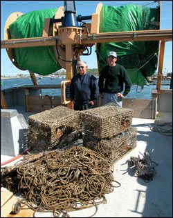 Frank Mirarchi (left) and Ben Cowie-Haskell (right) with some marine debris on the deck of Mirarchi's boat