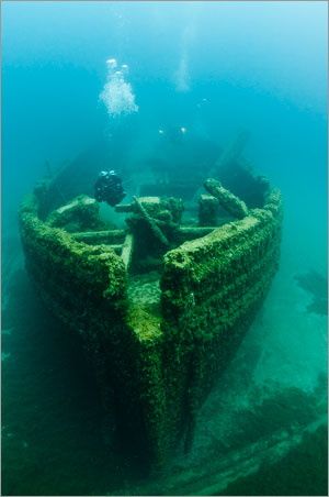 Diver explores bow of E.B. Allen in Thunder Bay National Marine Sanctuary.