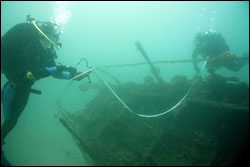 Divers map an unidentified vessel found during the survey of the former military training site. (Courtesy: University of Hawaii)