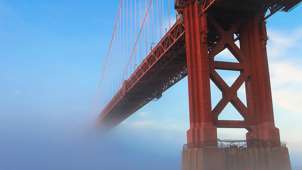 the golden gate bridge in fog