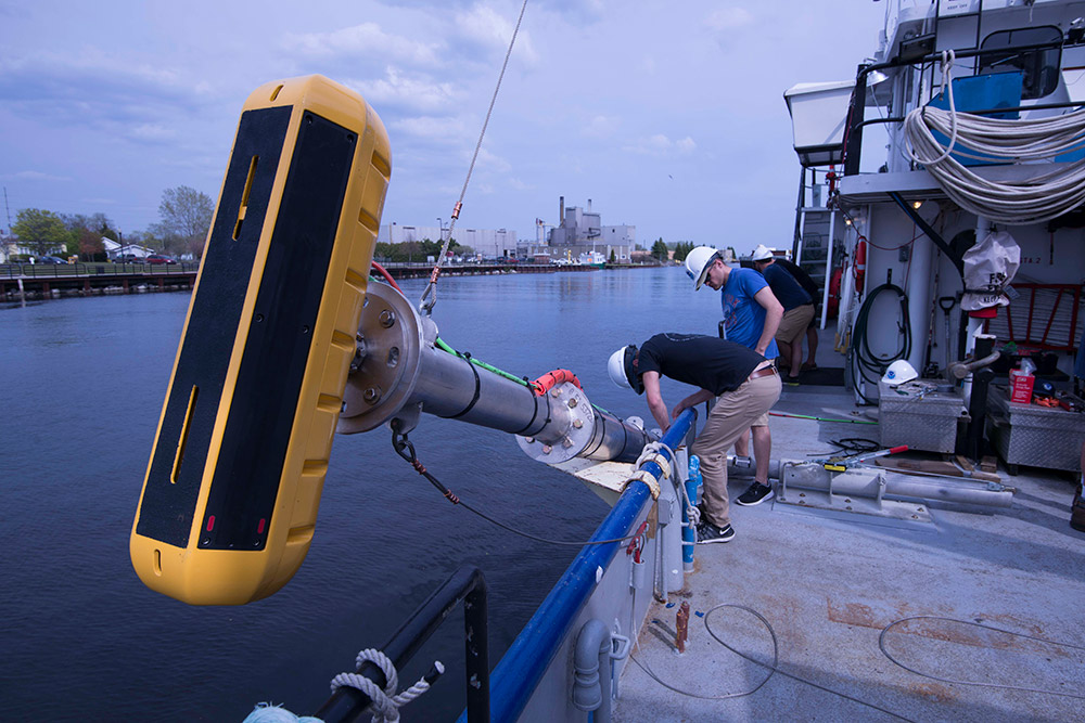technicians routing cables from an echosounder