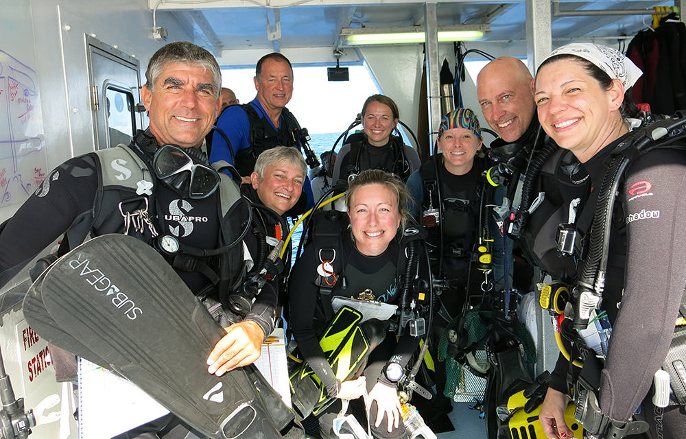 dive team posing for photo wearing their dive gear