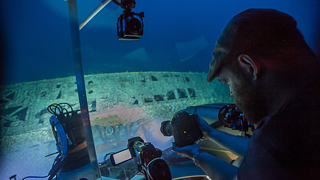 Joe Hoyt, Monitor National Marine Sanctuary maritime archaeologist, taking pictures of U-576 from inside the submersible