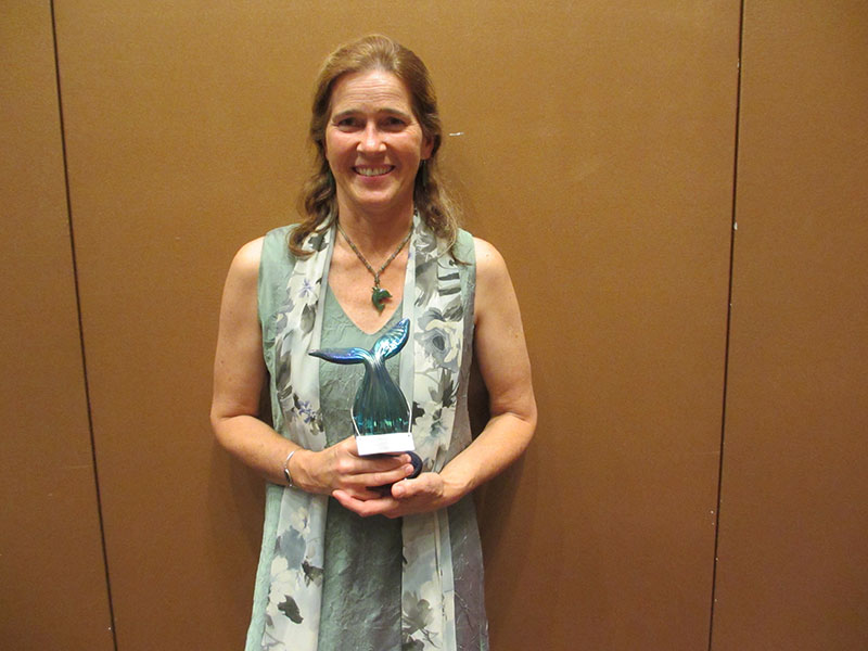 Photo of Carolyn Skinder and her award
