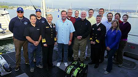 group photo of the science team with navy leadership