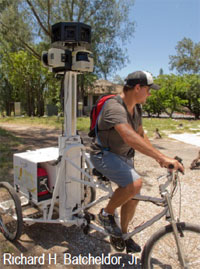 person capturing photos on a google bike