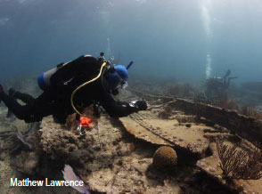 Photo of the diver and shipwreck