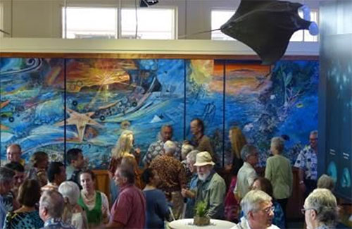 photo of people attending the discovery center re-opening
