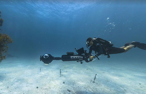 photo of diver holding a catlin seaview camera