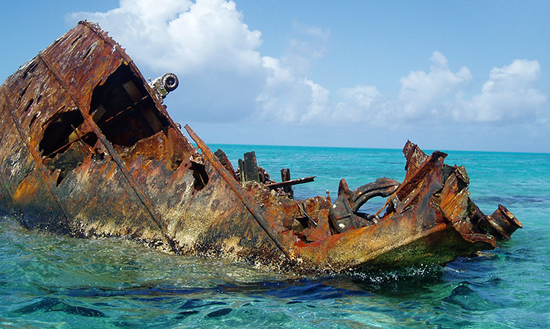 Photo of shipwreck in the water