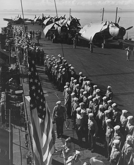 crew of independence at attention on deck