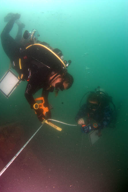 Divers taking measurements for the site plan